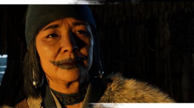 《羊蹄山戰鬼》遊戲螢幕截圖，描繪一名臉部有藍色顏料的女性角色。