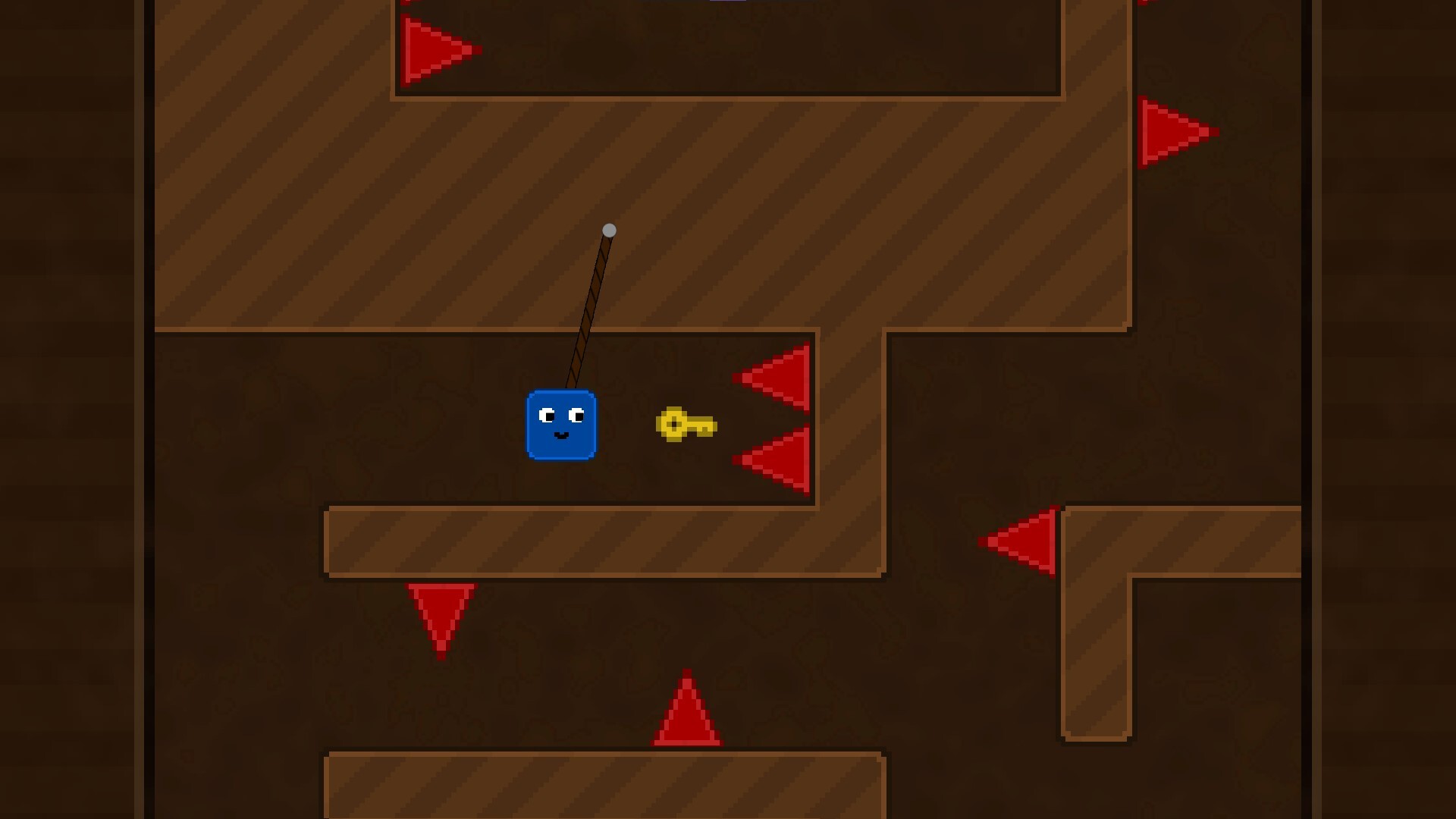 冒險者在坑洞中利用繩索擺盪